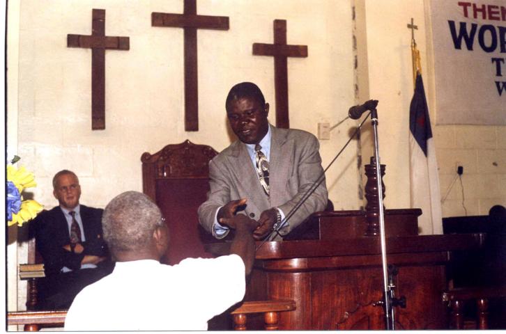 Pastor Vaye receives the new office keys from Dea. Samuel Karr